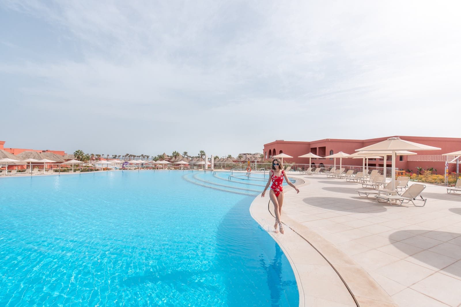 A guest enjoying a resort swimming pool in Egypt